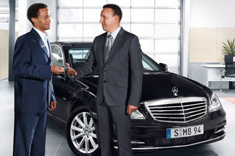 september coupons Mercedes-Benz man buying car in a dealership Littleton