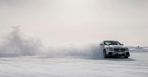 Mercedes-AMG vehicles drift across ice in the 360 experience, Comfort Zone. Luxury Ski Lifts resorts Colorado